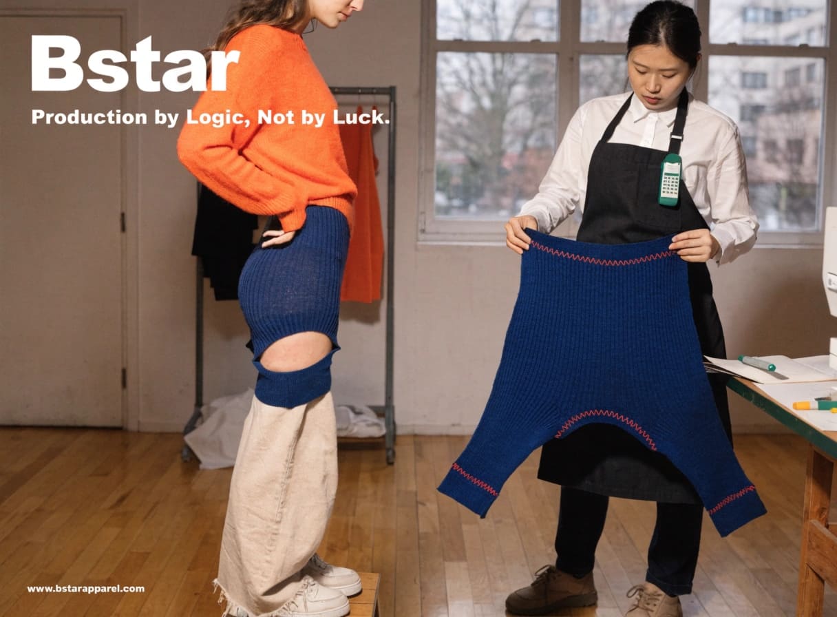 BSTAR quality control inspection of blue ribbed knitwear garment by factory worker
