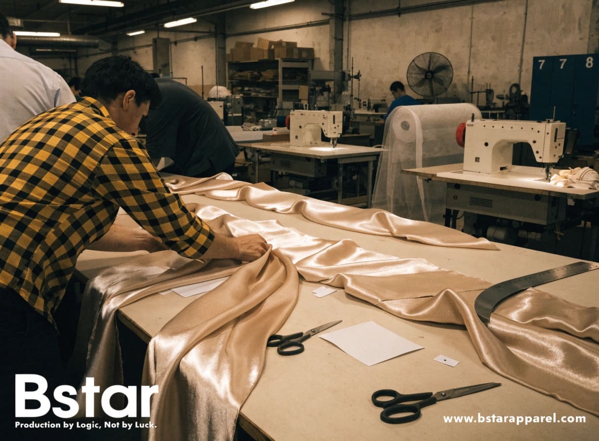Factory floor view of silk fabric being handled during cutting and stitching operations